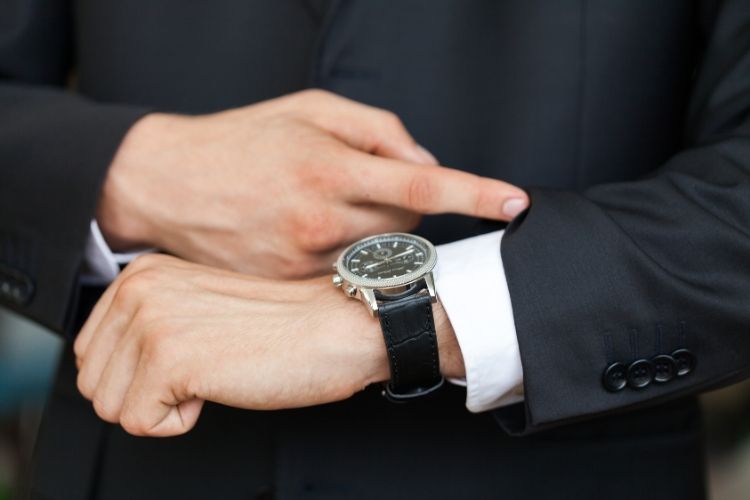 businessman looking at watch